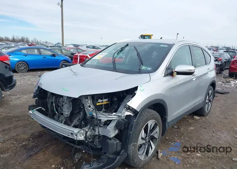 2016 Honda Cr-V Touring z USA, uszkodzony, nr VIN 5J6RM4H96GL119261